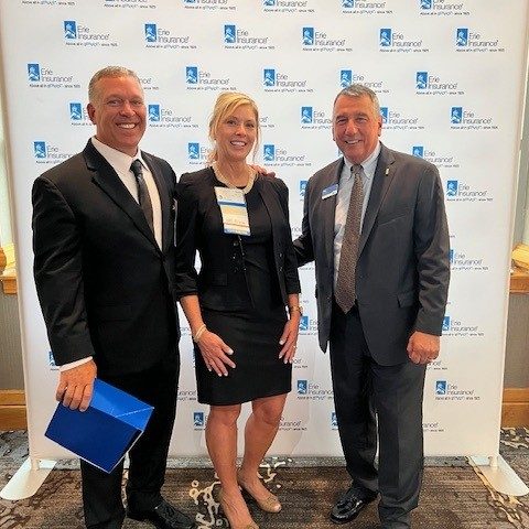 From left: agency owner Reid Myers, agency owner Beth Myers, and Erie Insurance President and CEO Tim NeCastro.
