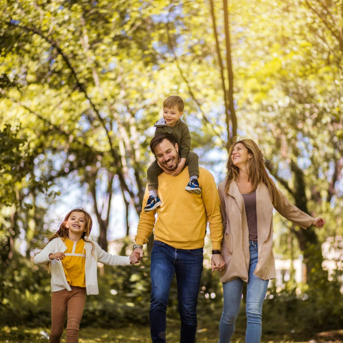 Family outdoors Family walking together outdoors on a sunny day